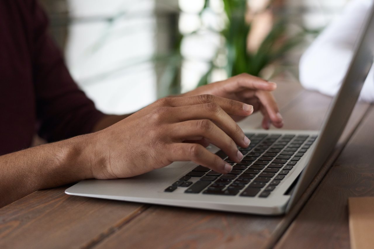 Person writing ESG communications on laptop